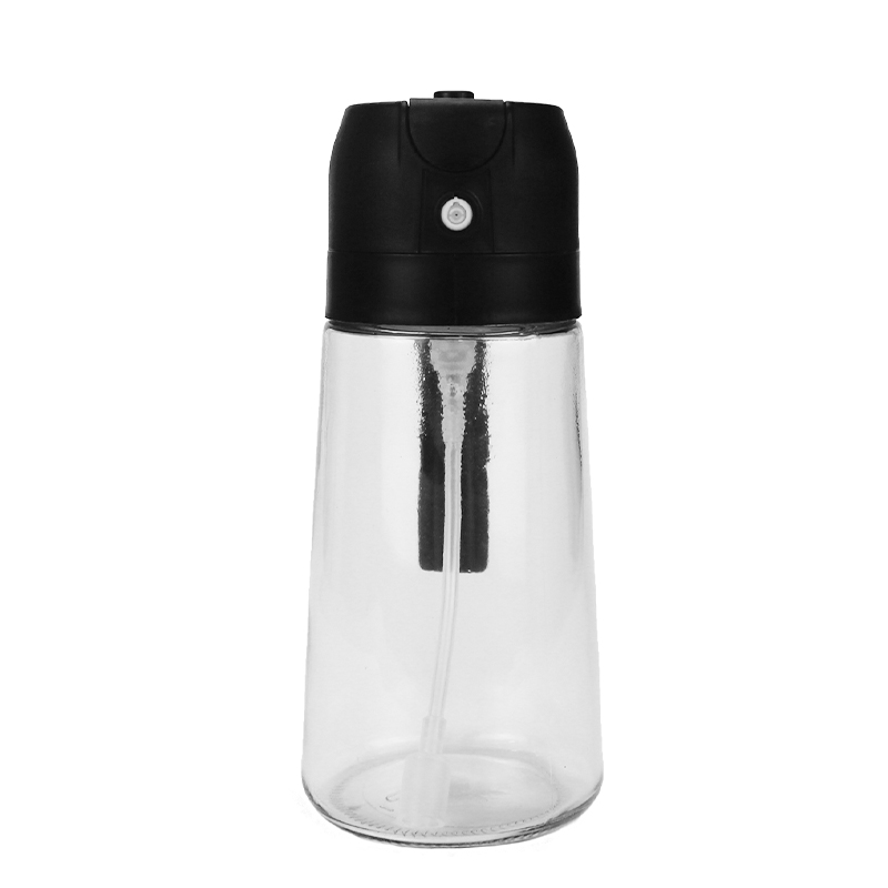 2-in-1 Oil Sprayer & Dispenser with Gravity Lid – Black in use